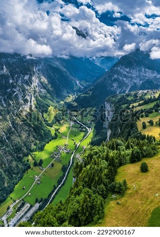 Lauterbrunnen valley with famous church and Staubbach waterfall. Lauterbrunnen village, Berner Oberland, Switzerland, Europe. Spectacular view of Lauterbrunnen valley in a sunny day, Switzerland. Royalty-Free Stock Photo #2292900167