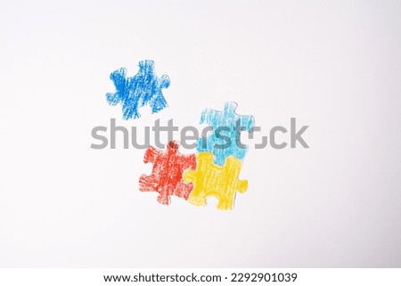Colorful puzzle on white background. Multi-colored heart as a symbol of World Autism Awareness Day. Flat lay