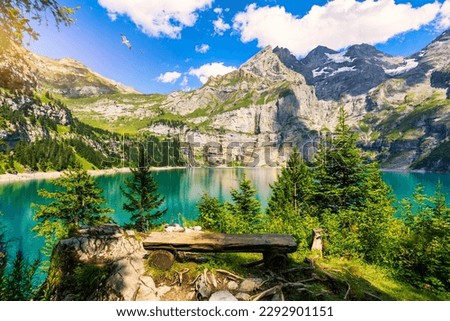Famous Oeschinensee with Bluemlisalp mountain on a sunny summer day. Panorama of the azure lake Oeschinensee. Swiss alps, Kandersteg. Amazing tourquise Oeschinnensee with waterfalls, Switzerland. Royalty-Free Stock Photo #2292901151