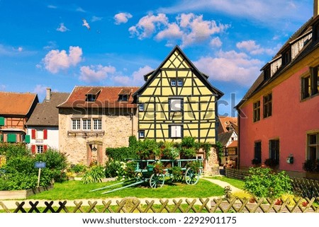Traditional timbered house in Turckheim, Alsace, France. One of the famous cities in Alsace scenic route near Colmar, France. Colorful traditional french houses in Turckheim town of Alsace, France. Royalty-Free Stock Photo #2292901175