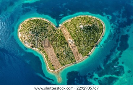 Aerial view of the heart shaped Galesnjak island on the adriatic coast, Zadar, Croatia. Heart shaped island of Galesnjak in Zadar archipelago aerial view, Dalmatia region of Croatia. Royalty-Free Stock Photo #2292905767