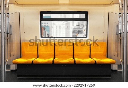 Empty Seat on Sky Train in the Capital Offers a Glimpse of the City.The first move in sky train with Empty passenger on seat Provides a View of the City Royalty-Free Stock Photo #2292917259