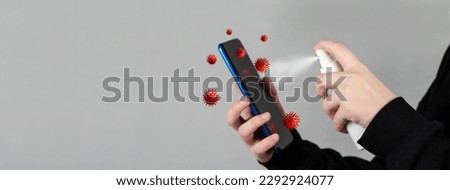 Human hand spray alcohol, disinfectant spray on mobile phone, prevent infection by virus, germs, bacteria. Smartphone with infectious bacteria and germs on the display. Royalty-Free Stock Photo #2292924077