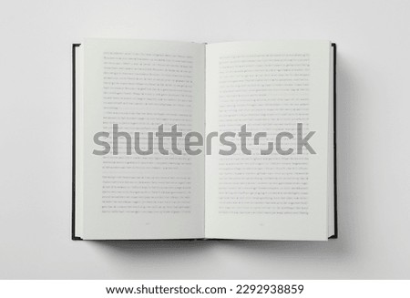 Open book on white background, top view Royalty-Free Stock Photo #2292938859