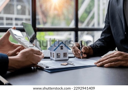 Real estate agents recommend interest rates, discuss the terms of the home purchase agreement, and ask clients to sign paperwork to legalize the contract.