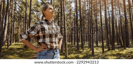 female forester or forest engineer. forestry and forest management. banner with copy space Royalty-Free Stock Photo #2292943213