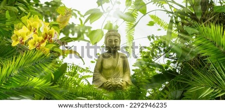 smiling buddha statue in a fresh wild green tropical garden, beautiful asian spirit nature background for wallpaper decoration for travel wellness relaxation and work -life-balance
