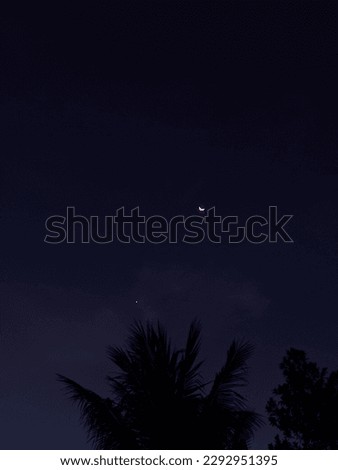 crescent moon and planet Venus (evening star) at sunset in one picture frame
