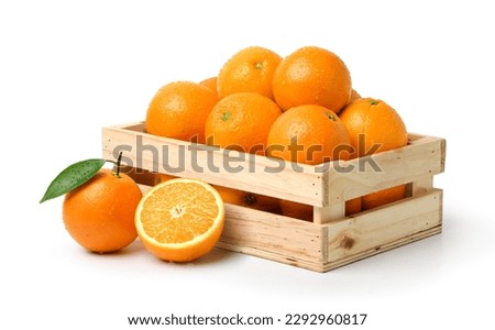 Fresh oranges with water droplets in wooden crate isolated on white background. Clipping path. Royalty-Free Stock Photo #2292960817