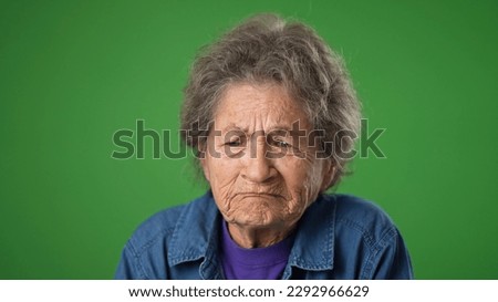 Tired depressed elderly mature toothless old woman 80s with migraine headache posing isolated on green screen background studio. Closeup people lifestyle concept. Put hands face