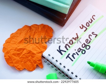Brain from paper and inscription Know your triggers. Royalty-Free Stock Photo #2292977605