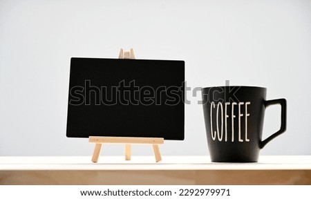 blank blackboard and a cup of morning coffee,copy space