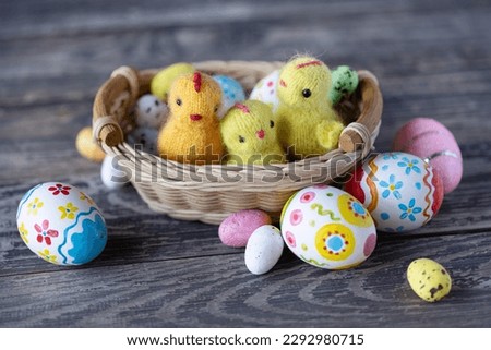 Knitted chickens on a wooden background