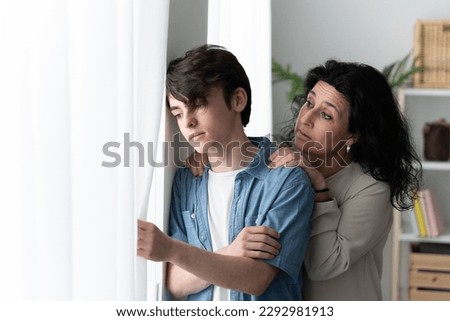 Mother comforting sad teenager son. Depression in adolescence concept Royalty-Free Stock Photo #2292981913