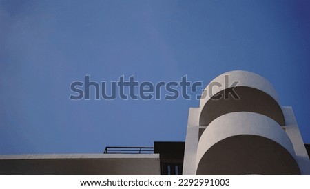 abstract minimalist white building facade against sky