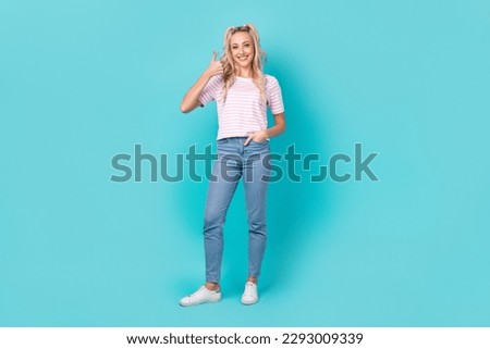 Full length photo of lovely nice person hand finger demonstrate thumb up isolated on blue color background