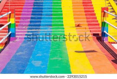 Colorful rainbow stair with canal bridge up from freshwater lake in one of tourist attractions in Thailand. Rainbow is symbol LGBTQ is term used to refer to people of different gender is diverse group