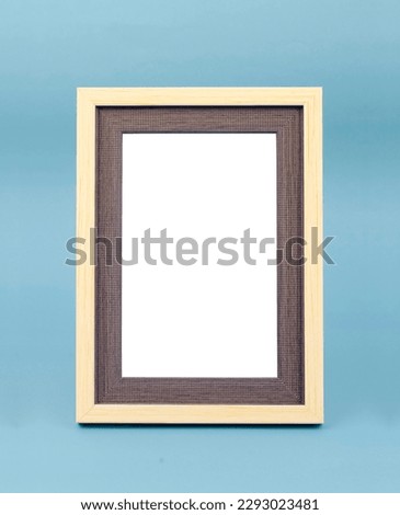 Blank picture frame on blue floor with copy space and clipping path for the inside.