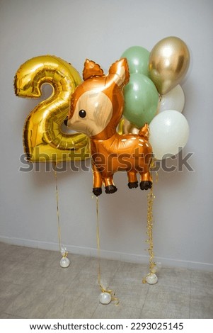 balloons with deer, golden number 2 on a white background