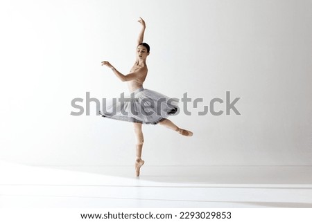 Tender soul. Portrait of young ballerina dancing, performing isolated over white studio background. Beauty of classical dance. Concept of classic ballet, inspiration, beauty, dance, creativity Royalty-Free Stock Photo #2293029853