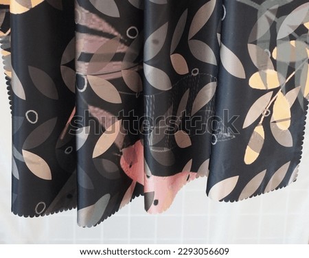 Photos of black hijab cloth with various motifs