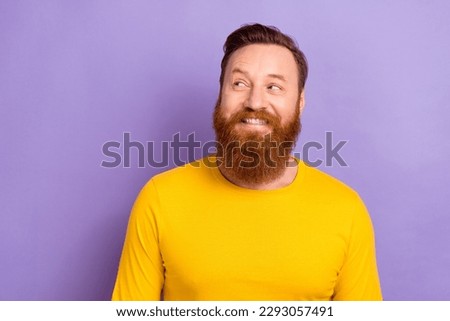 Photo portrait of young interested man business owner looking new ads makers company empty space offer isolated on violet color background