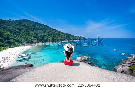 Asian woman in bikini with white sandy beach view Turquoise water at Similan Islands, Thailand Royalty-Free Stock Photo #2293064431