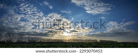 Panorama of cloudy sky with sunset Royalty-Free Stock Photo #2293070453