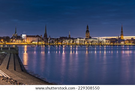 Night view on old city of Riga from embankment of the Daugava river, Latvia. In 2014, Riga is the European capital of culture