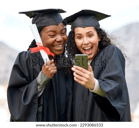 This is the happiest day of our lives. Closeup shot of two young women taking selfies on graduation day.