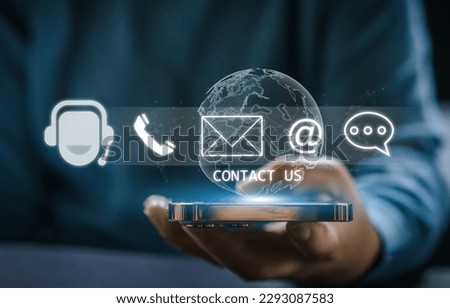 Human hand ues smartphone with call center on screen contact us, email, address, operator, customer, suppor, phone services agen, customer support hotline.contact us concept Royalty-Free Stock Photo #2293087583
