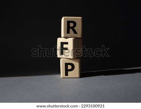 RFP - Request for Proposal. Wooden cubes with word RFP. Beautiful grey background. Business and Request for Proposal concept. Copy space. Royalty-Free Stock Photo #2293100921