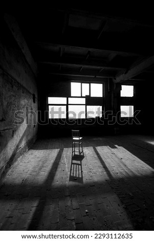 Black and white photo of abandoned building interior.