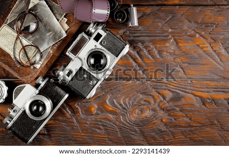 Old camera in the studio on an old background