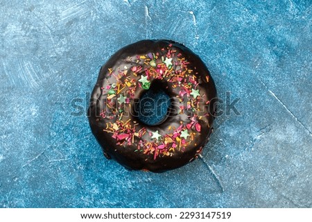 top view delicious choco donut on light-blue background photo sweet pie dessert sugar tea cake cookies Royalty-Free Stock Photo #2293147519