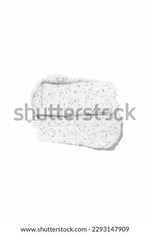 Smears of body scrub on white background. Fruit and berry body scrub texture of the swatch. Cosmetic smear Royalty-Free Stock Photo #2293147909