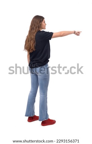 side view of a  young girl pointing on white background Royalty-Free Stock Photo #2293156371