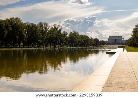 Washington, DC, USA - May, 2022: view of a pool of water, with the Lincoln Memorial in the far background.