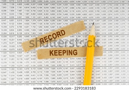 Business concept. On the documents with reports are a pencil and strips of paper with the inscription - Record keeping