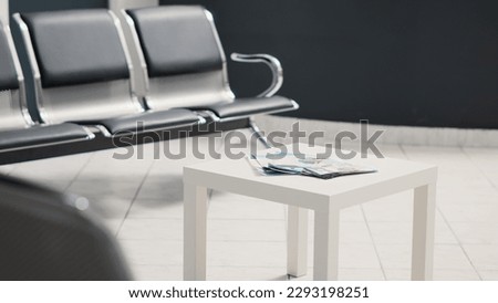 Empty waiting area at healthcare clinic, seats in hospital reception. Medical center used for emergency consultations and examinations, registration front desk with diagnosis report. Royalty-Free Stock Photo #2293198251