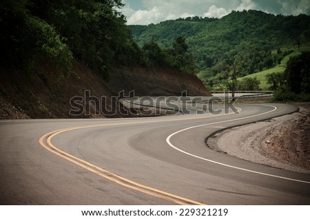 New winding road in the mountain Royalty-Free Stock Photo #229321219