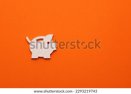 Piggy bank on orange color background - flat symbol for web site design or logo