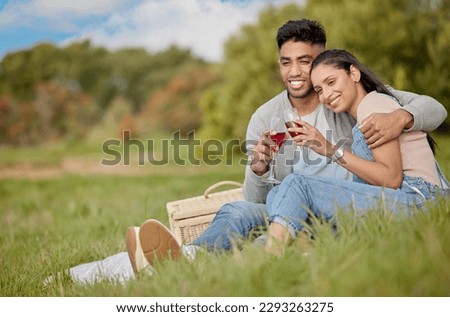You deserve someone who makes you feel special. a young couple sharing a toast while on a picnic.