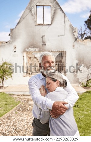 Losing your home is like losing a piece of your heart. a senior couple comforting each other after losing their home to a fire. Royalty-Free Stock Photo #2293263329