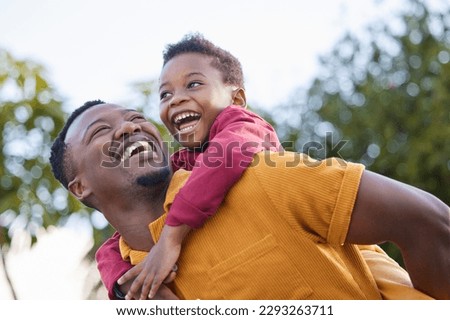 Lets go higher, dad. an adorable little boy enjoying a piggyback ride with his father in a garden. Royalty-Free Stock Photo #2293263711