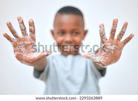 Keep your hands happy and healthy. a little boy showing his hands after washing them at home. Royalty-Free Stock Photo #2293263889