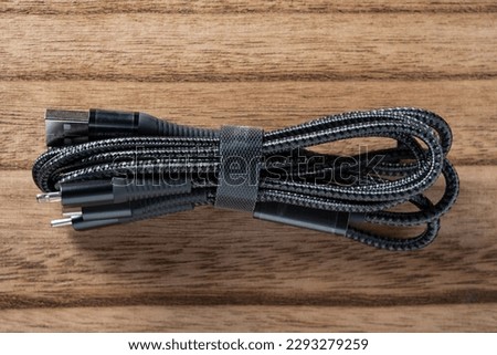 top view multi-plug cable on a wood background