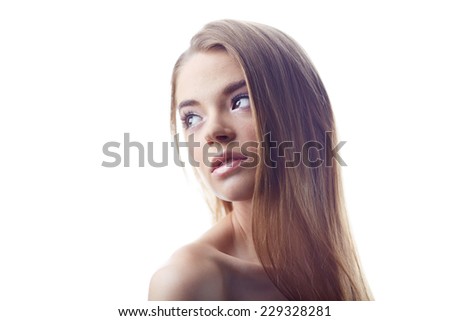 Calm woman with natural makeup posing in isolation