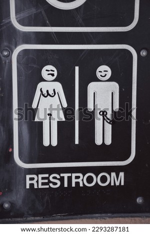 Restroom Sign Modified to be Funny