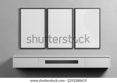 Indoor interior, show text or product. Frame Set of 3 Mockup Thin Frames Gallery on grey Wall. set of three frame. Clean, modern, minimalistic, bright. Portrait. Vertical. 3d rendering Royalty-Free Stock Photo #2293288619